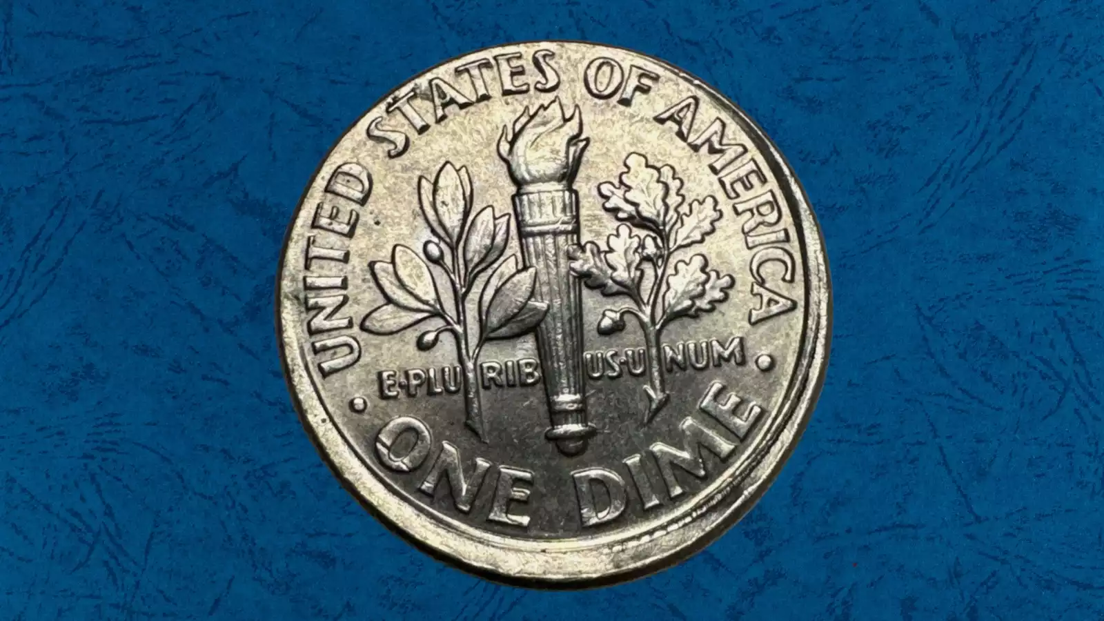 1959 dime off-center strike error showing misaligned die impression with blank planchet visible